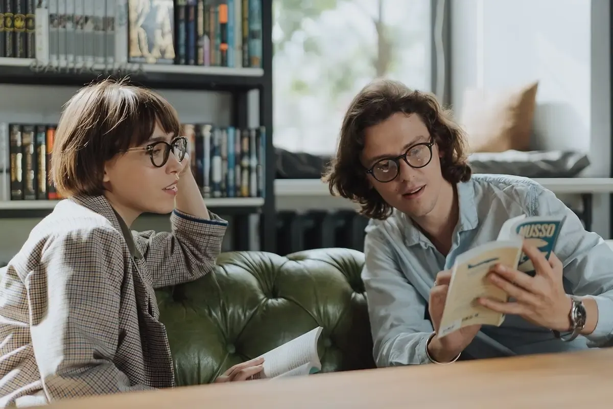 Two readers discussing a book